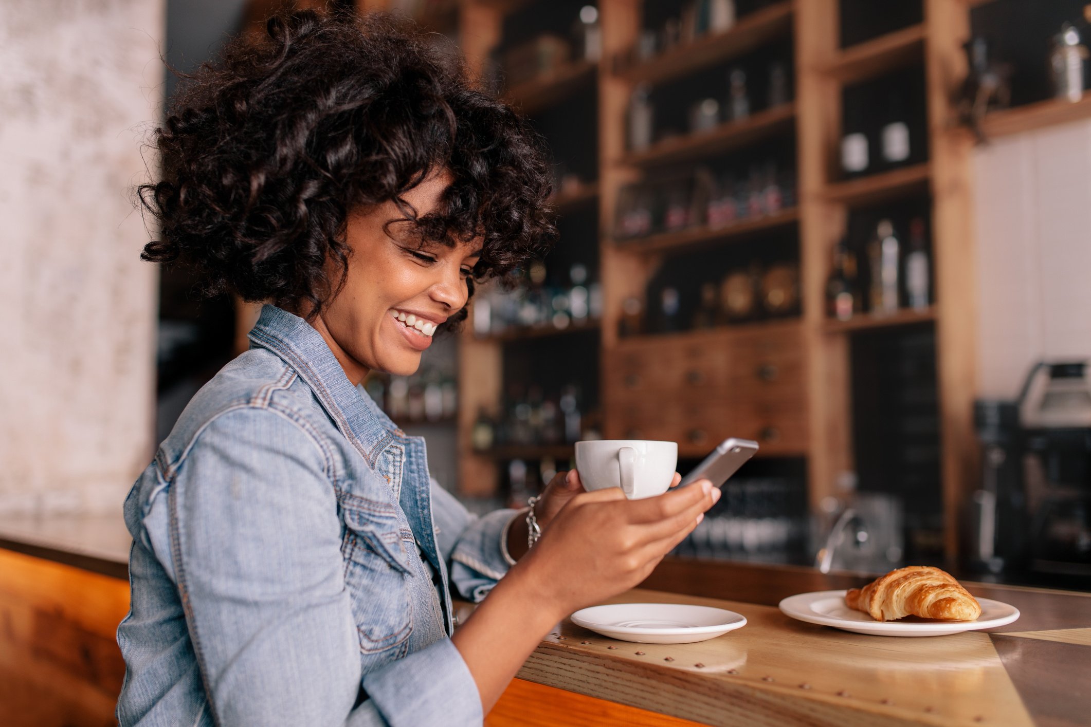 Smiling Woman Using Smart Phone