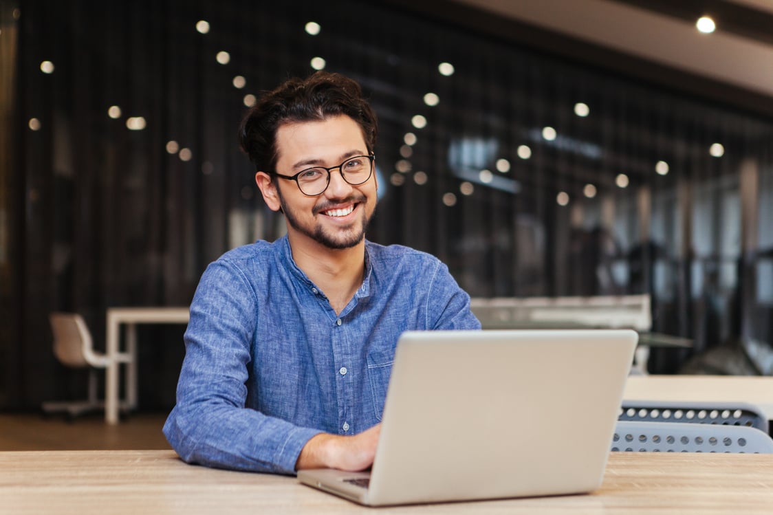 Man Using Laptop Computer in Office